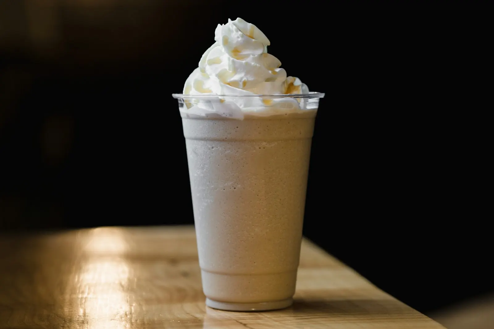 Creamy frozen blended coffee topped with whipped cream